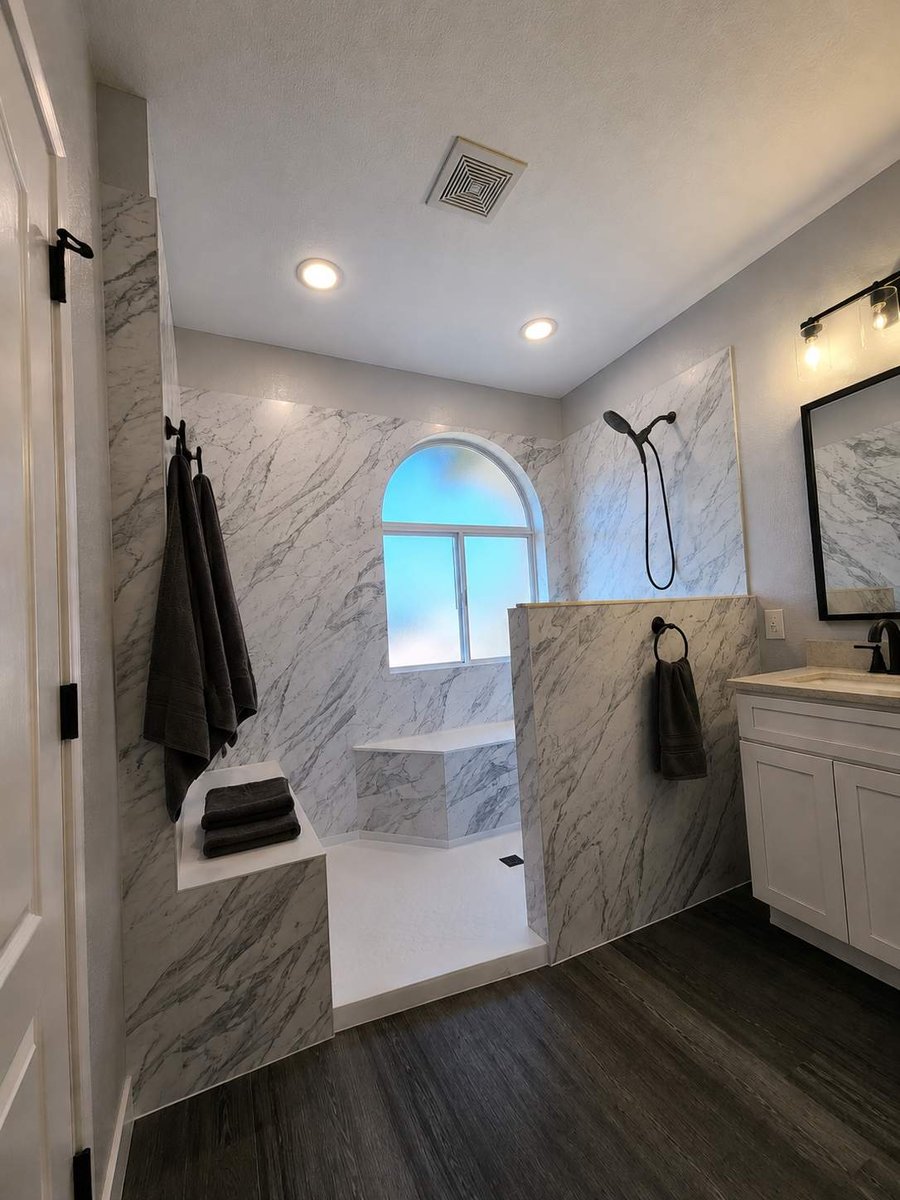 Large curbless marble walk-in shower