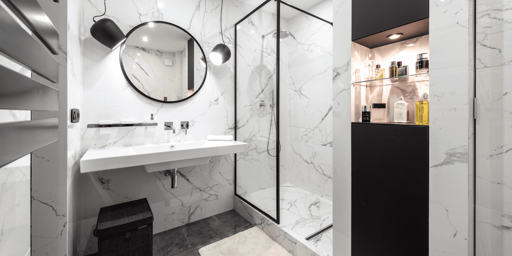 Stock Image of Round Mirror and Walk In Shower with Glass Walls in Bathroom Remodel