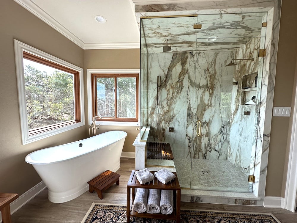 Bathroom with tile marbling in walk-in shower