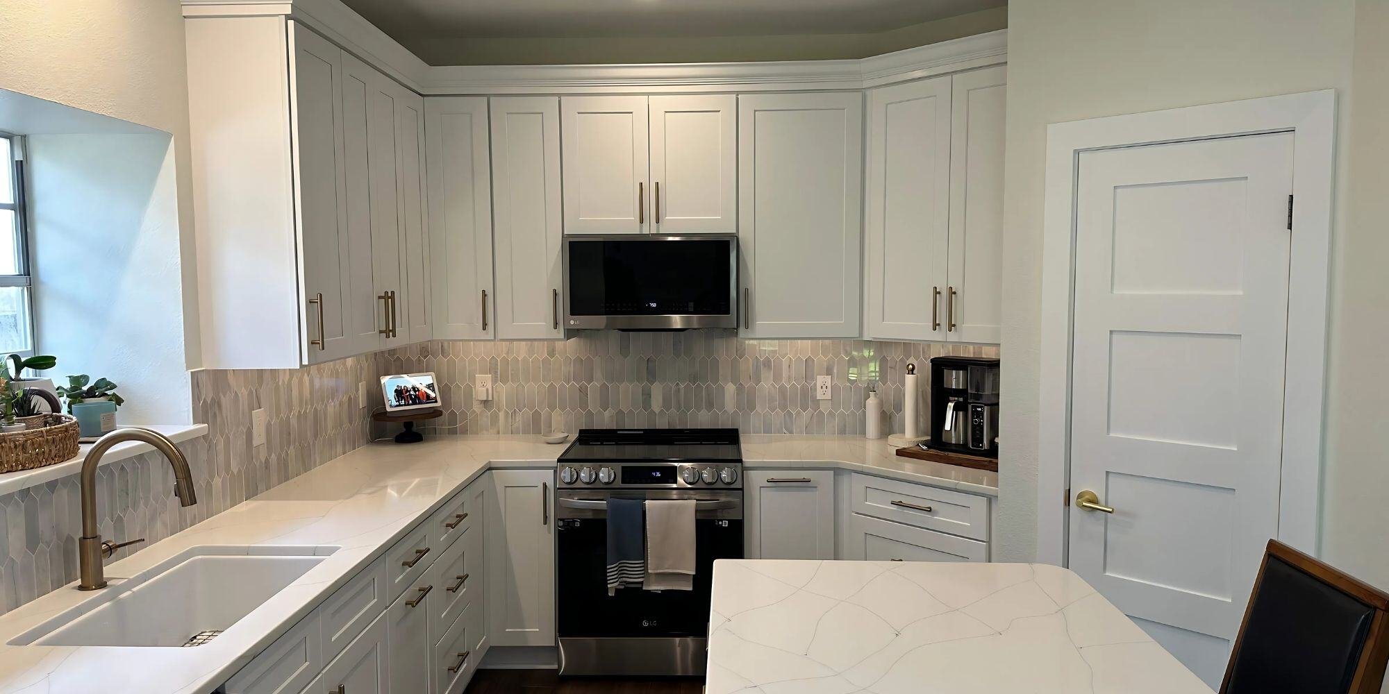 san antonio kitchen remodel with white cabinets and stainless steel appliances and light gray backsplash