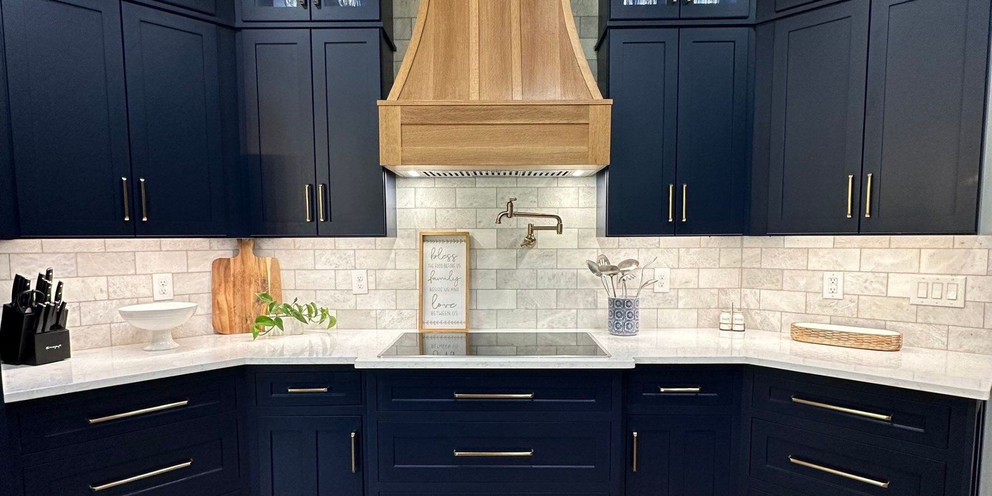 Kitchen remodel in san antonio with dark blue cabinets and light wood kitchen hood