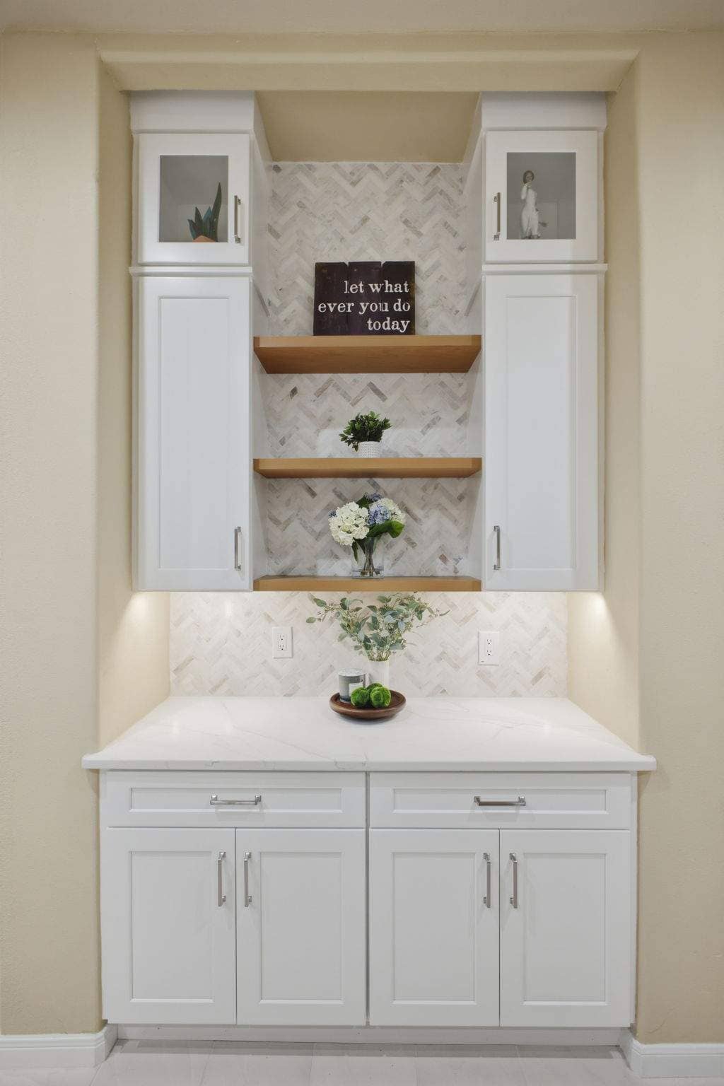 Bright Deerfield kitchen storage nook with white cabinetry, open wood shelves, and under-cabinet lighting. Bright Deerfield kitchen storage nook with white cabinetry, open wood shelves, and under-cabinet lighting.