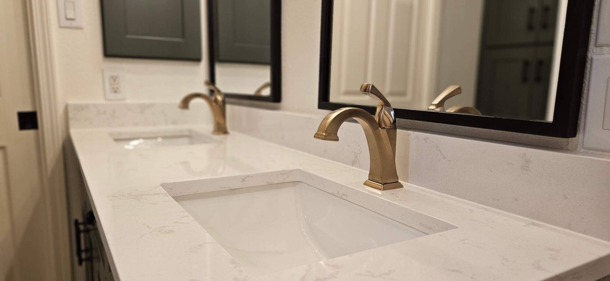 White Granite Countertop with Square Sink and Brushed Brass Faucets 