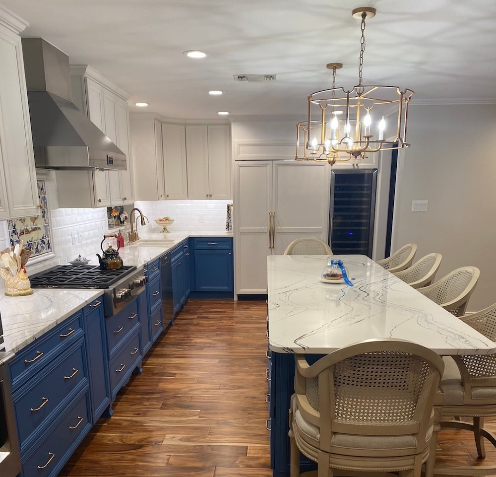 Kitchen with blue lower cabinets and white upper cabinets