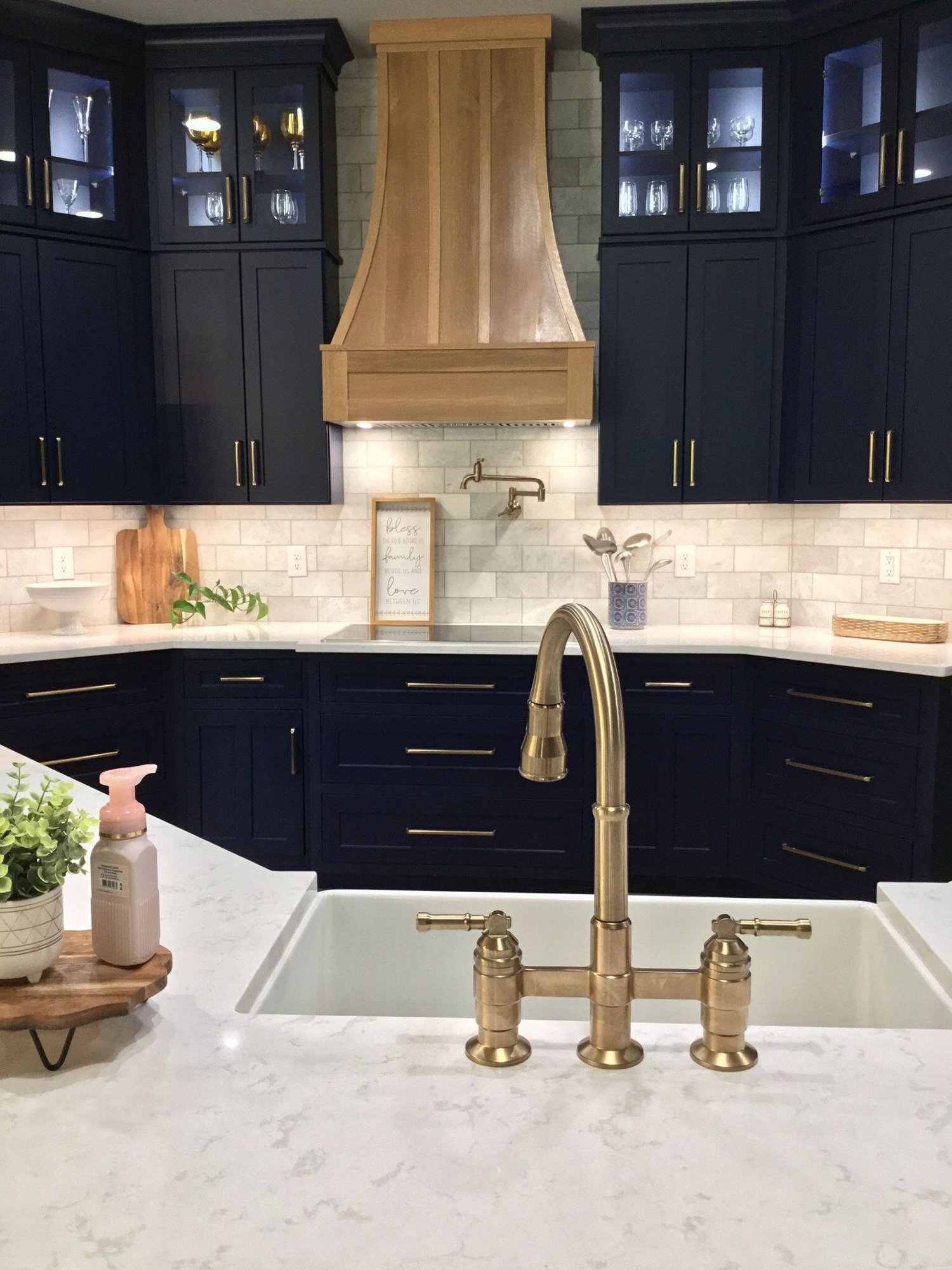 San antonio kitchen remodel with gold faucet, white countertops, and blue cabinets