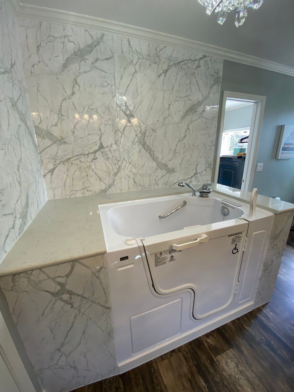 Walk-in tub installation with marble surroundings by Legacy Kitchen & Bath in San Antonio