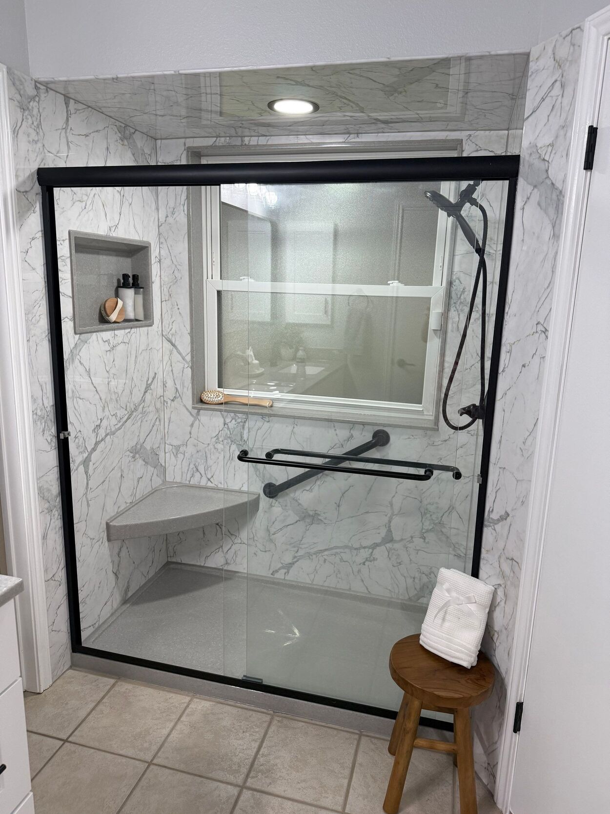 tub to shower conversion bathroom remodel in san antonio with marble black and white design