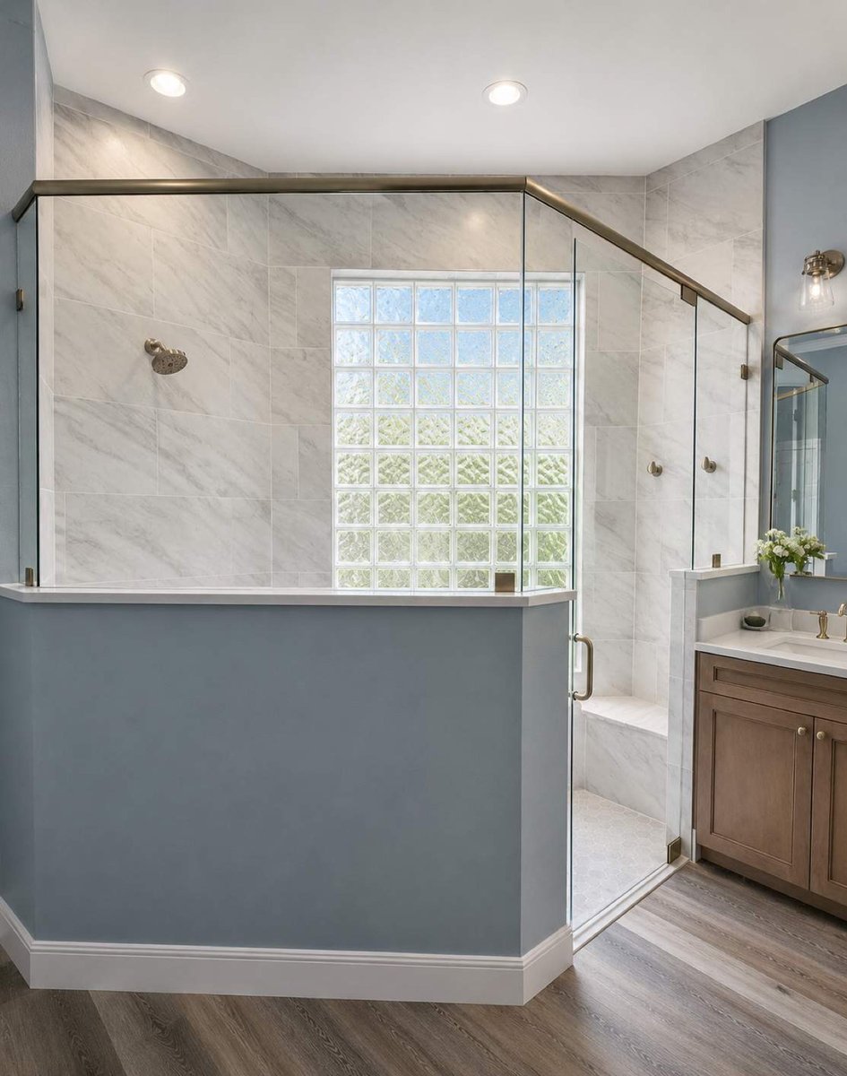 Neo-angle glass shower with slate blue half-wall and glass block window