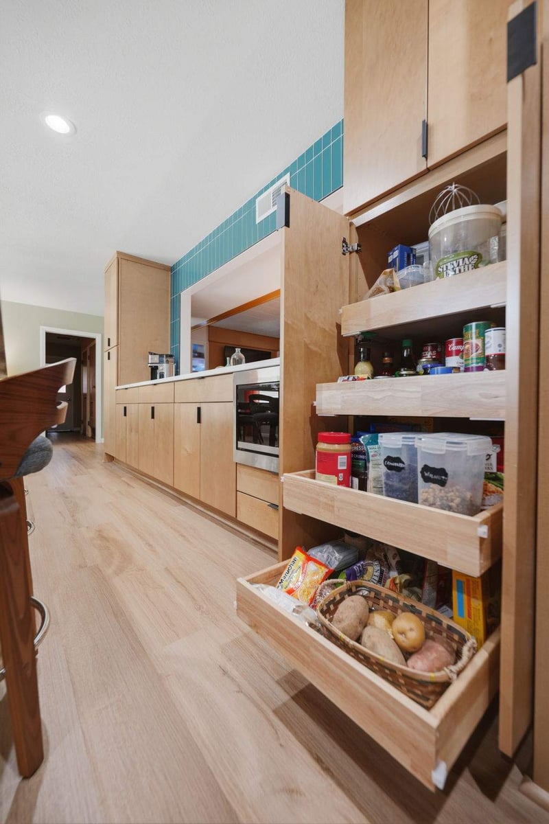 Custom kitchen pantry cabinet with pull-out storage shelves