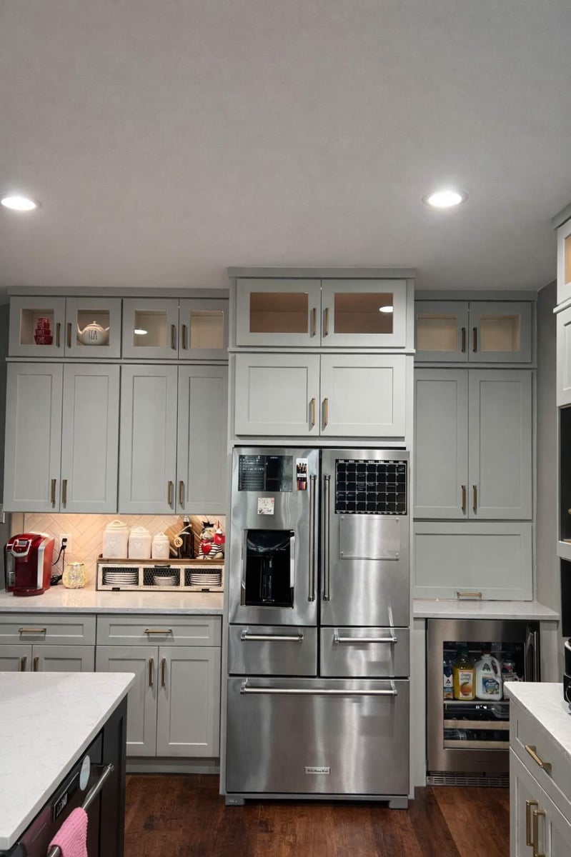 Gray shaker cabinets framing a stainless French-door refrigerator with built-in beverage fridge