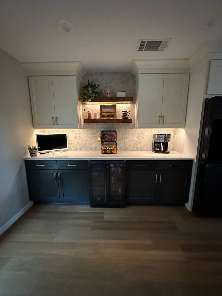 Coffee bar with cream uppers, dark lowers, wine fridge and floating shelf