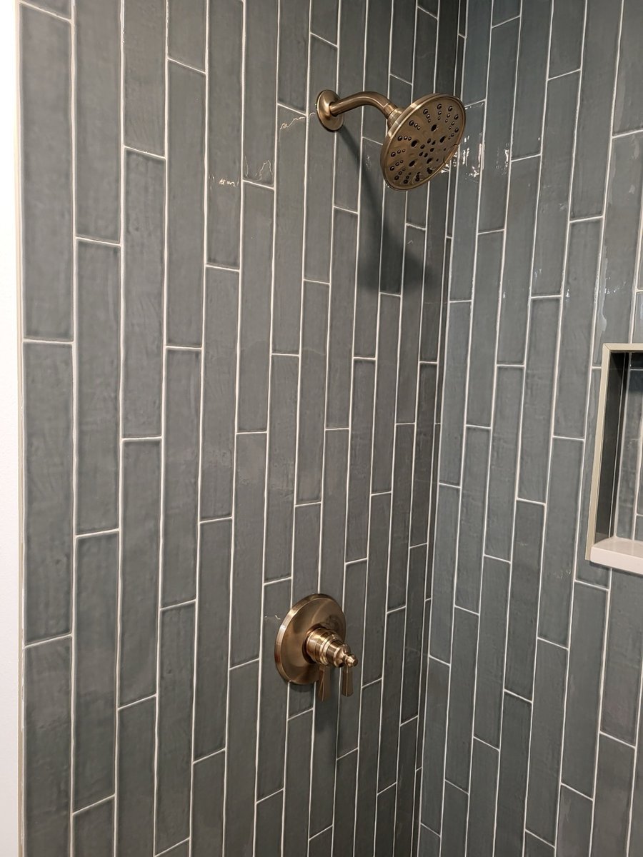 Brass crystal-bead chandelier mounted on the bathroom ceiling