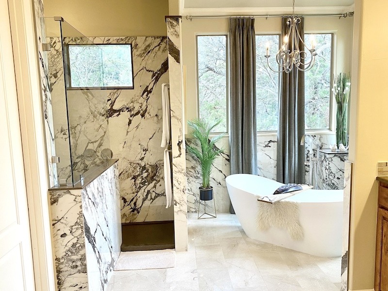 Bathroom with granite shower and standalone tub