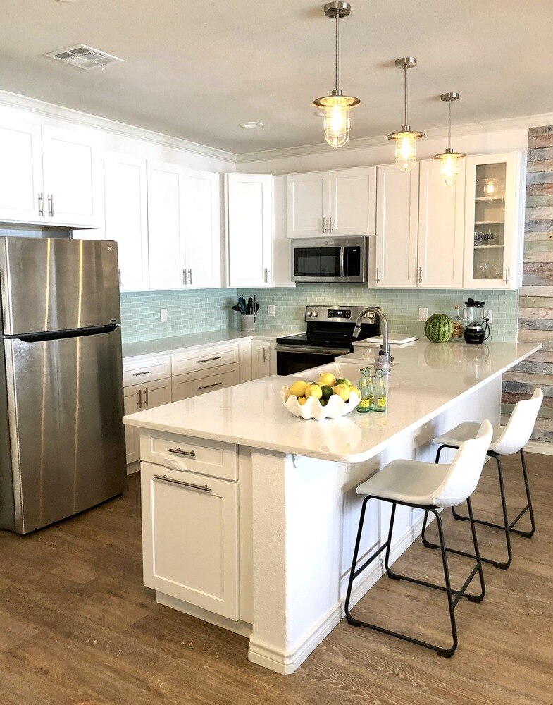 Kitchen with white cabinets and countertops