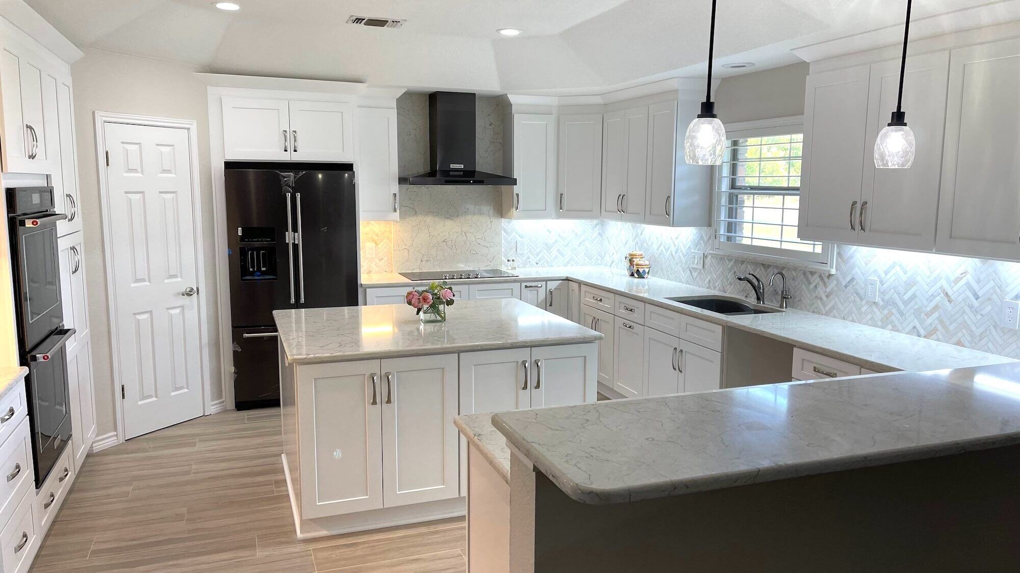 Kitchen with white cabinets and quartz countertops