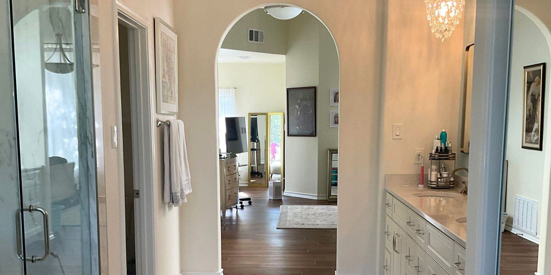 Elm Creek, Texas Bathroom Remodel featuring frameless shower enclosure and custom ivory cabinets