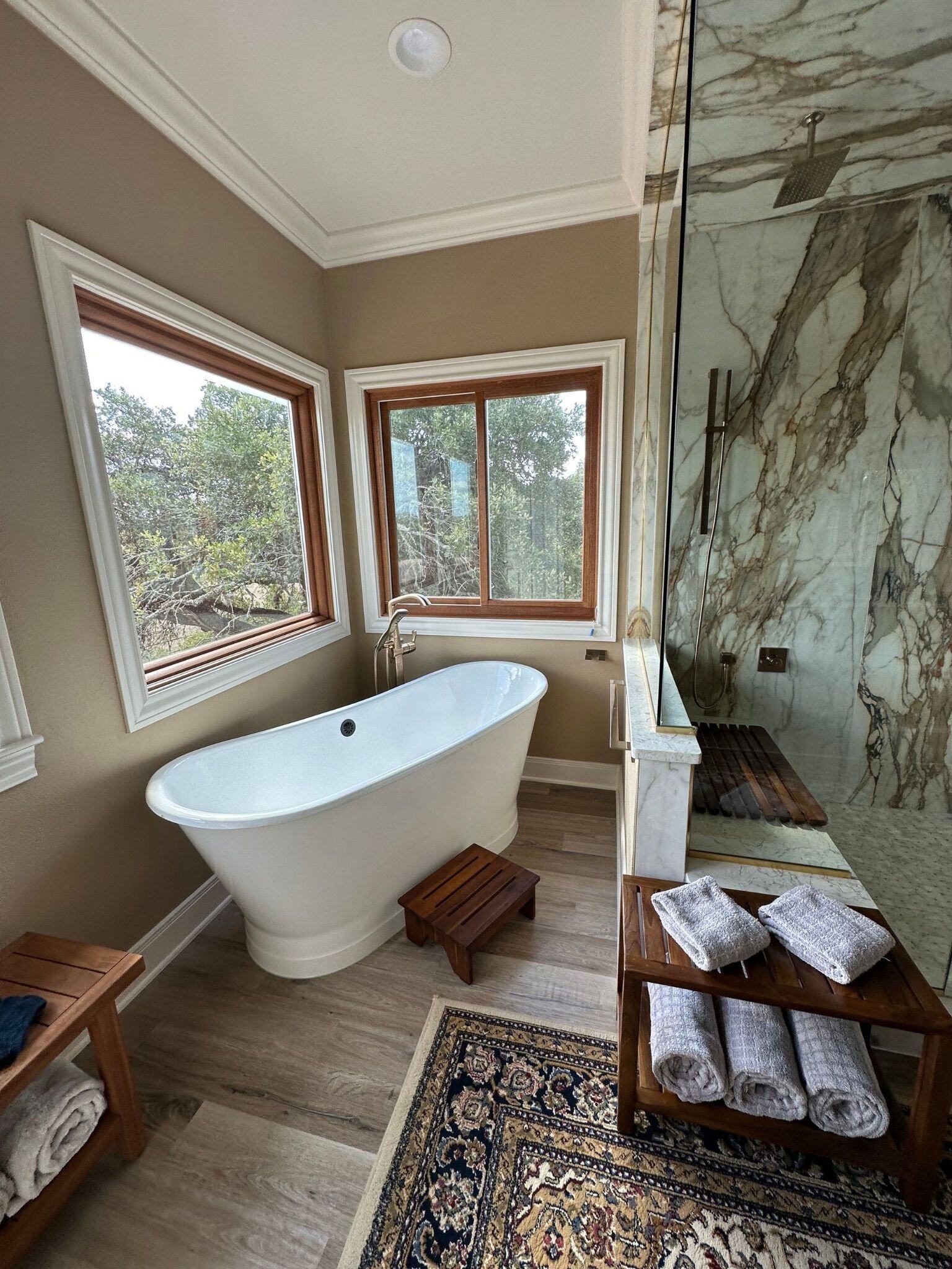 white free standing tub in a primary bathroom remodel