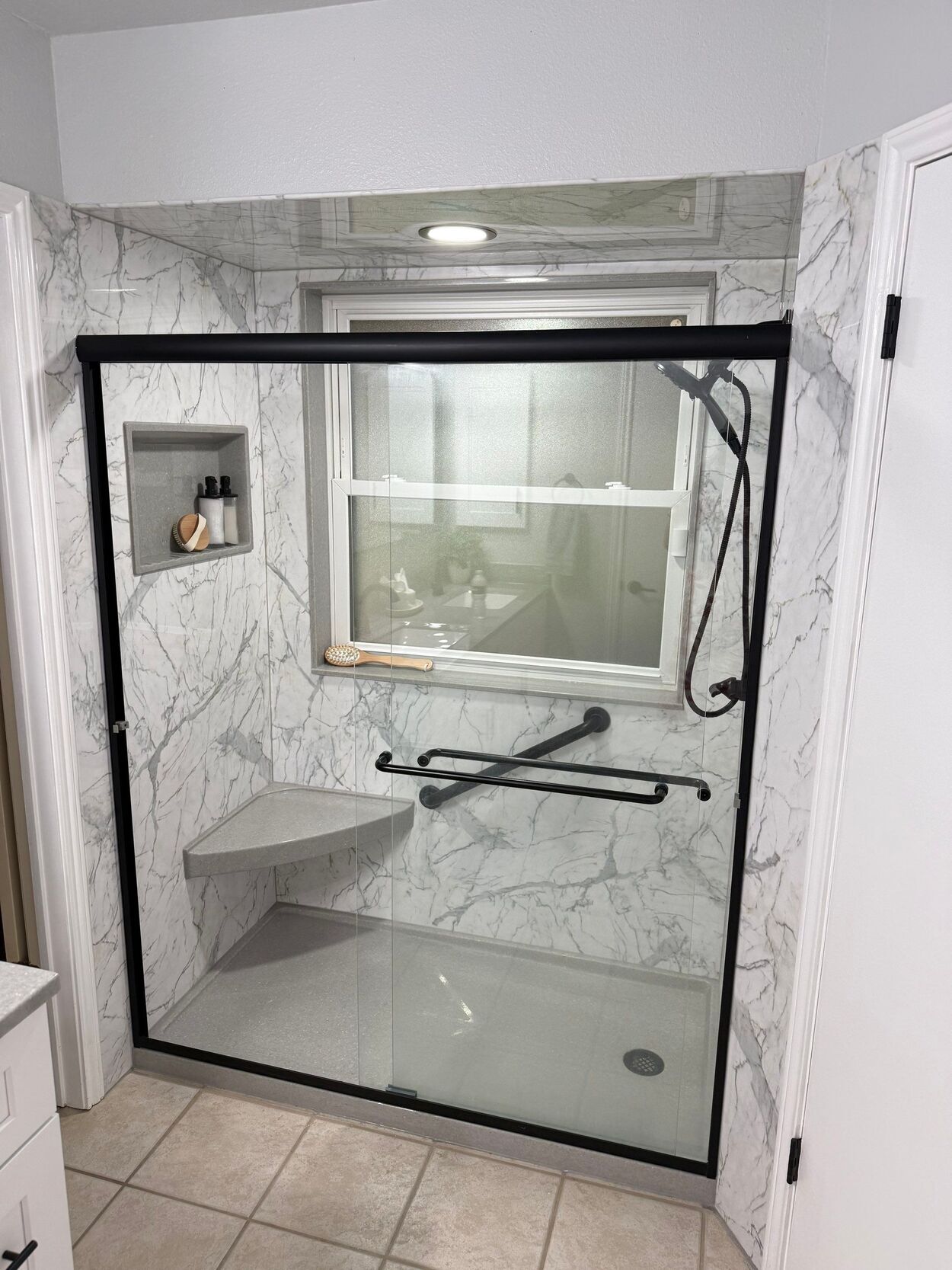 tub to shower conversion bathroom remodel in san antonio with marble black and white design