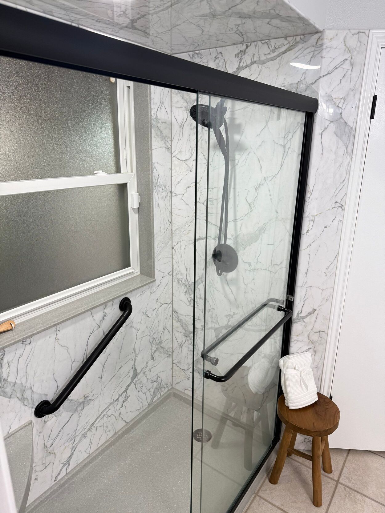 tub to shower conversion bathroom remodel in san antonio with marble black and white design