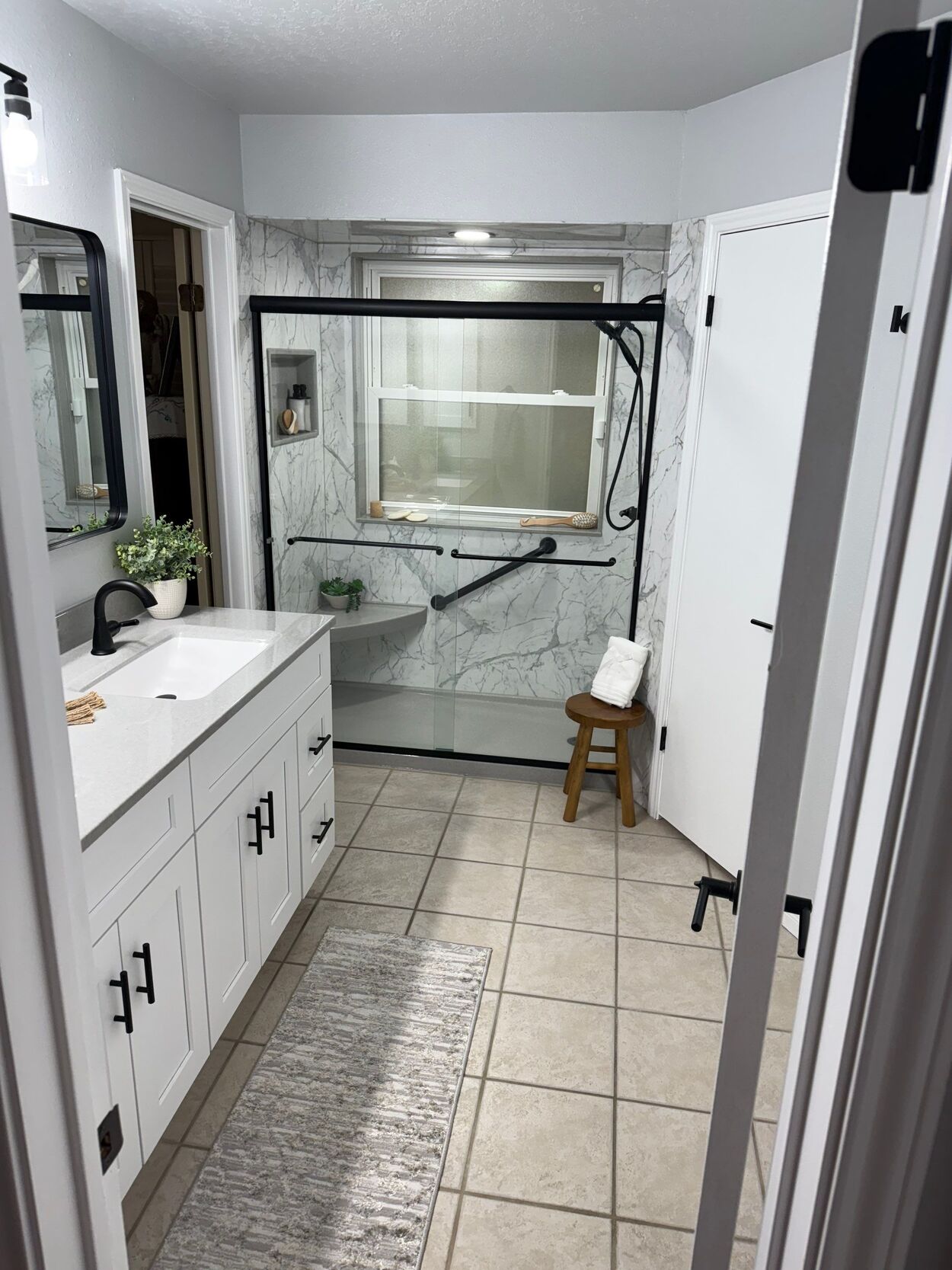 tub to shower conversion bathroom remodel in san antonio with marble black and white design